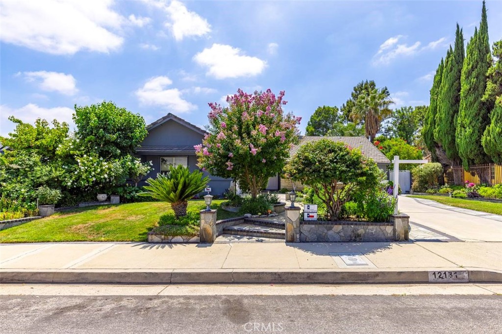 Lush Garden Retreat with Pool, Spa & Mountain Views in Granada Hills’ Knollwood Community:
Step into a home where the backyard feels like a private botanical sanctuary—lovingly cared for and thoughtfully designed by the owner. Bursting with colorful blooms, lush green lawn, and fruit trees including fig, apple, and grape, this remarkable outdoor space surrounds a sparkling pool and spa, all framed by breathtaking mountain views. Whether you’re relaxing in the jacuzzi, enjoying a sunset drink, or hosting weekend gatherings, this backyard is truly the soul of the home—and a rare find.
Located in the highly sought-after Knollwood neighborhood of Granada Hills, this 4-bedroom, 2.5-bathroom home offers 2,343 sq ft of comfortable living in a top-rated school district. Inside, a bright and airy kitchen with a cozy breakfast nook opens into the family room, which flows directly to the garden—blending indoor and outdoor living beautifully.
The living room features a fireplace and backyard access as well, creating a welcoming atmosphere throughout. The spacious master suite includes a walk-in closet and a sun-filled bathroom with a jacuzzi soaking tub and a brand-new walk-in shower, all with views of the tranquil garden.
This home is a rare opportunity to live in a peaceful, beautifully maintained retreat where nature, comfort, and everyday living come together seamlessly.