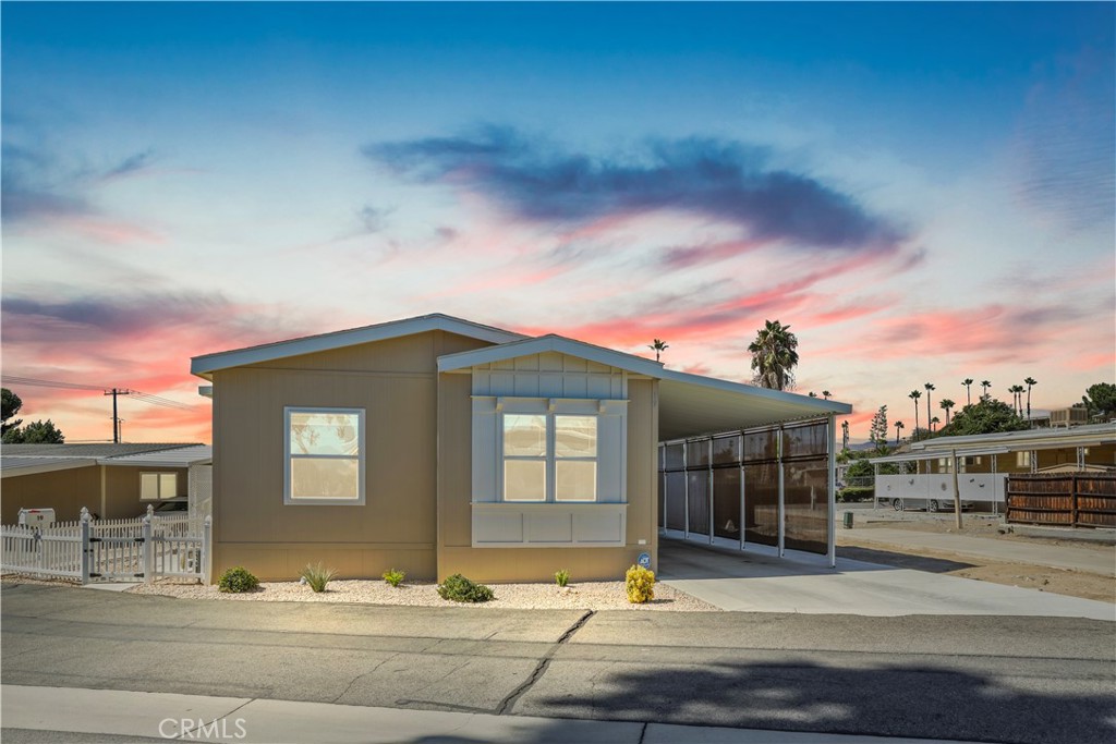 Located in the 55+ manufactured home community of Echo Hills Estates, This newer beautiful 2023 Skyline home has 3 bedrooms and 2 bathrooms at approximately 1080 square feet. Throughout the home there are room darkening shades that you can pull down for extra privacy and light blocking. This is a long covered patio with a storage shed. This home comes with stainless steel stove, dishwasher, and microwave with its large kitchen island. The beautiful spacious master bedroom has comfortable carpet and a walk-in closet with its large master bathroom with a walk in shower. This home has carpet and linoleum flooring, washer/dryer hook-ups in its individual laundry room, and a covered carport. The carport even has additional coverings with new shades to offer additional coverage for you and your vehicles. There is a nice gated area off of the front entry way. Echo Hills Estates offers a clubhouse, pool and RV storage. HURRY THIS HOME WON'T LAST! GREAT FOR FIRST-TIME HOME BUYERS! DON’T MISS OUT! TURN KEY & PRIDE OF OWNERSHIP. MOVE IN READY AND IS A MUST SEE!