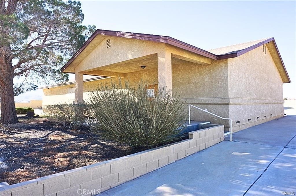We are proud to offer for sale is this well-maintained ±3,496 sq ft religious facility located in the heart of Lucerne Valley. The interior features a spacious main sanctuary with seating for 200+, a large stage, private offices, a storage room, and two restrooms.
Ideally positioned near local schools, restaurants, and shops, the property offers excellent visibility and accessibility. Exterior highlights include a large concrete parking lot with 60+ spaces, block wall fencing, a private water well with pump house, septic system, propane tanks, and two HVAC units.
This property is well-suited for continued use as a church or religious facility, and also presents opportunities for a community center, childcare facility, or general office use (subject to zoning and approvals).