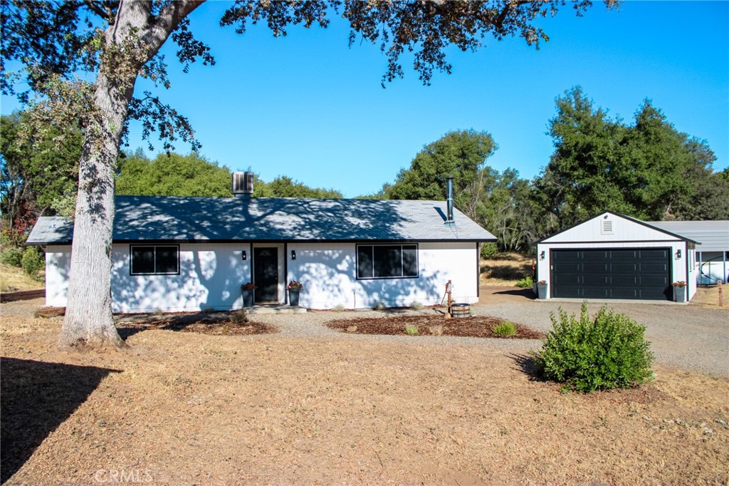 A Hidden Gem Off Darrah Road in Mariposa!
Tucked away in one of Mariposa’s most desirable areas, this adorable and updated 2-bedroom, 2-bathroom home is full of charm, character, and thoughtful upgrades, ready for your next chapter, whether you're a small family, a first-time buyer, or looking for a fantastic investment.
Step inside to find brand new wood-style tile flooring that flows throughout the home, complemented by fresh interior paint and cozy carpet that’s just four years young. The heart of the living space features a brand new wood stove, framed by authentic stonework and a custom-crafted mantle made from local wood, talk about Mariposa magic.
The kitchen is newly remodeled and designed to impress: freshly painted cabinets, sleek can lighting, and butcher block countertops give it a modern farmhouse feel that’s equal parts functional and fabulous.
Details like the charming barn wood door leading to the laundry room, a fenced-in backyard perfect for pets or playtime, and a detached two-car garage with RV parking make this property as practical as it is picturesque.
Outside, the exterior was freshly painted within the last year, making the curb appeal just as inviting as the interior. And with plenty of space to enjoy now or grow into later, this property is truly the best of both worlds.
Prime location. Perfect size. Packed with personality.
