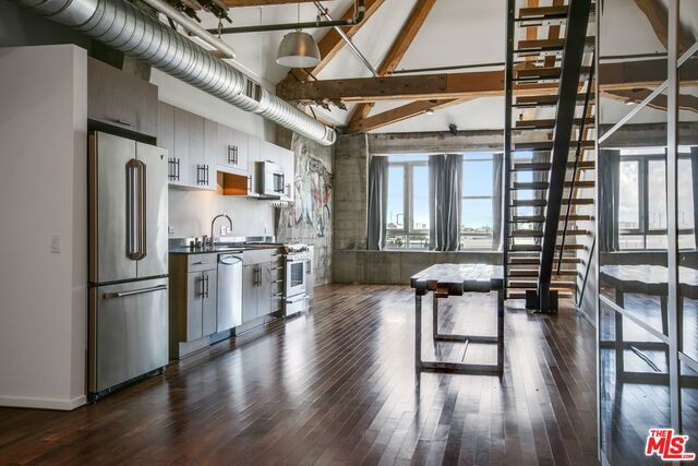 Two Level Penthouse Loft at Barker Block. Live/Work Loft with 1300 sf ft and 17' ceilings. Unobstructed views of the DTLA skyline, SS appliances, designer bath, washer/dryer in-unit, hardwood floors. Gorgeous resort-style rooftop pool/spa/fireplace/fitness center with WIFI. 24/7 Security. Across from Urth Caffe and Central to all Fwys. Walk to Goldline, DASH bus, SciArc, Little Tokyo, Zinc Cafe, dog park, Urban Radish, hip new restaurants and coffee shops in the trendy Arts District.