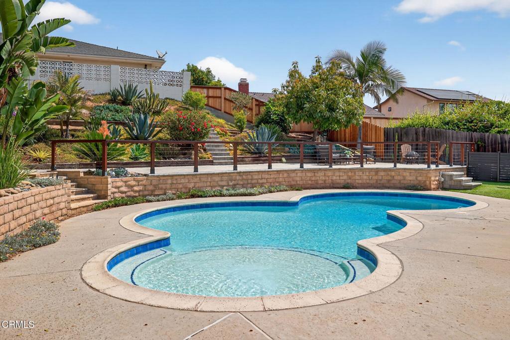Welcome to this beautifully updated paradise pool home located in one of Ventura's most desirable neighborhoods above the college. From the moment you arrive, you'll be captivated by the resort-style backyard, featuring terraced landscaping, a sun lounging deck, and a sparkling pool--perfect for relaxing or entertaining.Inside, the home offers a flexible and functional layout. One private bedroom and bath are located in a separate wing, ideal for a mother-in-law suite, guest quarters, or a potential ADU lockout. The remaining three bedrooms are move-in ready with new carpet. Each bathroom has been tastefully remodeled, featuring modern tile work and sleek, clean finishes. A cozy den provides the perfect space for a home office, playroom, or creative studio.Major upgrades include owned solar, an updated central heating, a newer electrical panel, and a rebuilt chimney. The roof top deck offers the perfect viewing point for 4th of July fireworks. Don't miss this rare opportunity to own a versatile, well-maintained home in a sought-after Ventura location.