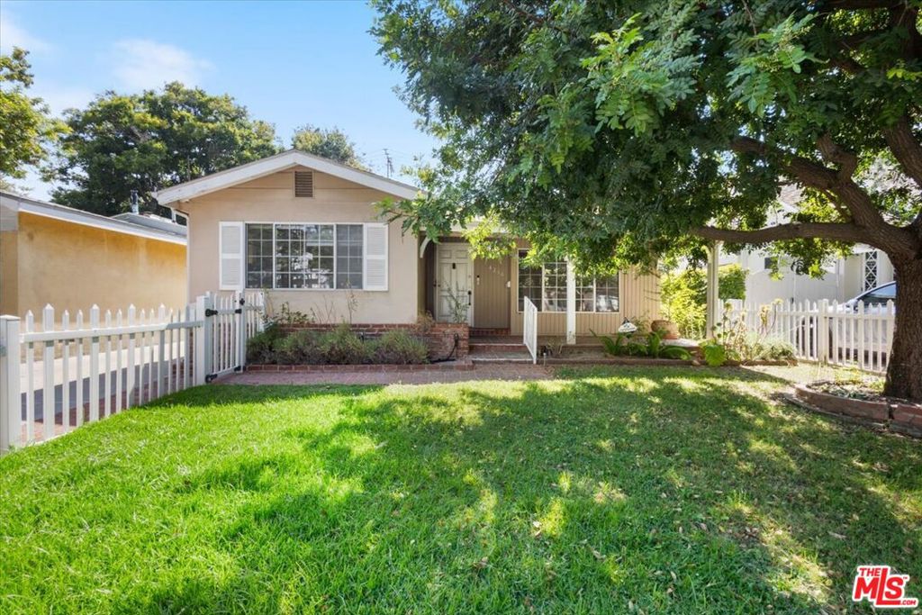 Welcome to 4210 Alcove Ave on one of the best streets in Studio City. Featuring a very cute grassy front yard with a large shade tree, tucked behind a white picket fence on a quiet, tree-lined street. This single-level residence features a spacious living room with fireplace, formal dining, and a separate family room. The kitchen boasts newer stainless steel appliances, including a newer range and oven, plus a sunny breakfast nook. The primary suite opens to a private, brick-paved yard, while two additional bedrooms share a full bath with a soaking tub and shower. Other highlights include two water heaters and two central AC systems, laminate and carpeted floors, a dedicated laundry room with washer/dryer, and a detached 2-car garage down a long driveway.Located minutes from studios, freeways, Ventura Blvd and across the LA River from the Sportsman's Lodge with Erewhon Market, Equinox, shopping and dining. A perfect blend of charm, location, and livability. Needs TLC. Easy access to the Westside. Don't miss this Studio City gem!