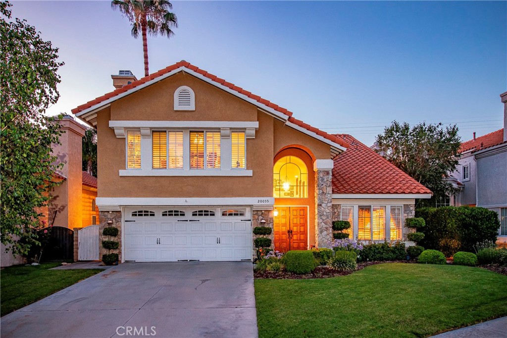 Pride of ownership shines in this charming 4-bedroom plus bonus room, 2-bathroom home! Nestled in a cul-de-sac, it boasts beautiful curb appeal with a well-manicured lawn and mature landscaping. Upon entering, you'll appreciate the open floor plan featuring vaulted ceilings and ample natural light. The tasteful design includes neutral-colored carpet, soft paint tones, and wood flooring. Notable upgrades consist of recessed lighting, custom archways, plantation shutters, and ceiling fans throughout. This home offers both a formal living room and a formal dining room. The kitchen is equipped with granite countertops, abundant cabinets, stainless steel appliances, and an island, making it perfect for cooking and entertaining. The cozy family room features a fireplace, ideal for chilly days. One bedroom and a full bathroom are conveniently located downstairs. The remodeled downstairs bathroom boasts granite countertops and a standalone shower. The laundry room, also on the lower level, includes multiple storage cabinets and a folding countertop with a sink. Upstairs, you'll find three spacious bedrooms, including a primary bedroom with a vaulted ceiling and a large walk-in closet fitted with built-in shelf organizers. Both upstairs bathrooms have been upgraded; the guest bathroom features granite countertops, dual vanity sinks, custom tile flooring, and a tub/shower enclosure with custom tile accents. The primary bathroom includes dual vanity sinks with granite countertops, a jacuzzi tub, and a large standalone shower adorned with polished rock flooring, custom tile backsplash, and a built-in bench seat. An oversized bonus room upstairs offers beautiful built-in oak shelving and cabinetry, as well as another fireplace, making it a great space for entertaining or potentially serving as an extra bedroom. Step outside to enjoy a park-like setting, complete with well-maintained trees and shrubbery, a low-maintenance artificial turf lawn, concrete hardscaping, stepping stone walkways, and planter walls. A lattice-covered patio with dual ceiling fans, a built-in barbecue with an island, a lamp post, a water feature, and a park bench enhances the outdoor experience. Additionally, a shed is included for ample storage. This home features an energy-efficient solar system and a newer tile roof, replaced in 2023. The spacious two-car garage comes with hanging shelving for extra organization. This home is a true must-see to appreciate all it has to offer!