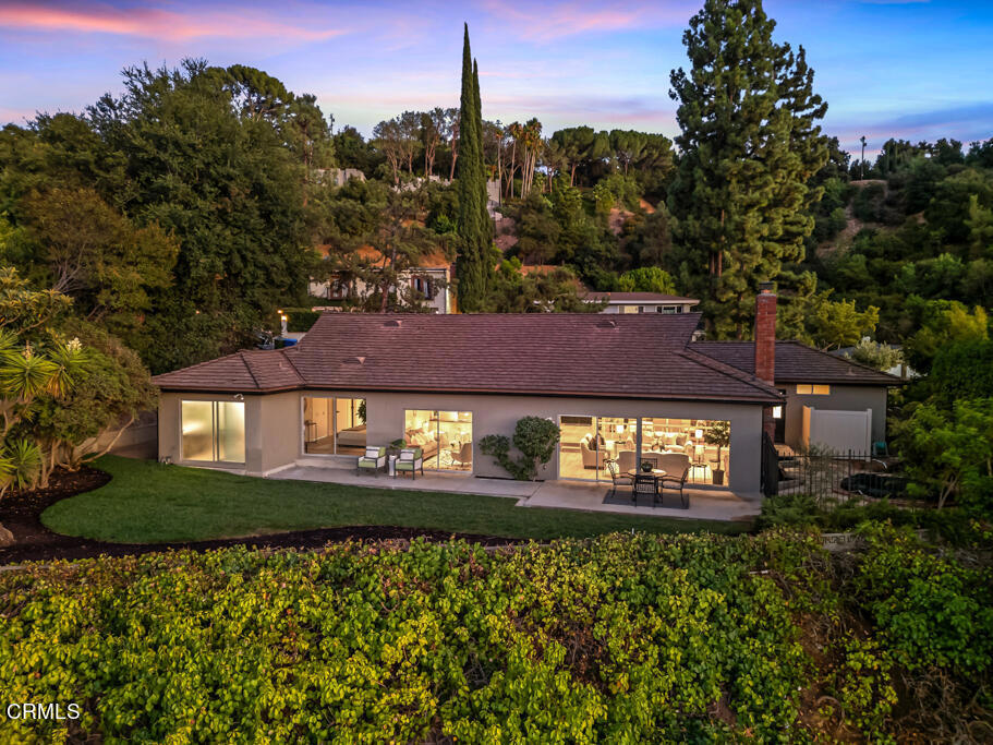 Relax and revel in the breathtaking panoramas from this exquisite one-story mid-century ranch home. Cherished by the same family for over 50 years, the property is now ready for its next discerning owner. Situated on a serene cul-de-sac in the desirable Royal Woods neighborhood of Sherman Oaks, this home boasts an open floor plan that seamlessly integrates stunning vistas into daily living. Every aspect of the home is designed to enhance these captivating views. Whether you're enjoying a meal in the dining room, conversing in the light and airy living room, or relaxing in the den, the breathtaking vistas will be a constant delight. The residence features four spacious bedrooms and four bathrooms, providing flexibility for both growing families and those looking to downsize. The kitchen is equipped with a double oven, cooktop stove, and a casual dining area. It effortlessly flows into the light and airy formal dining room, which connects to the living room and leads to the den. The master suite serves as a private retreat, complete with direct access to the backyard, awe-inspiring views, an expansive closet, and dual vanities. The versatile fourth bedroom can be used as a guest suite, home office, or a tailored space to suit your needs. Additional highlights include an attached two-car garage, a freshly painted interior, newer flooring, and updated lighting. This rare opportunity to own a distinctive home with unparalleled views is not to be missed. Make this one-of-a-kind property yours today!