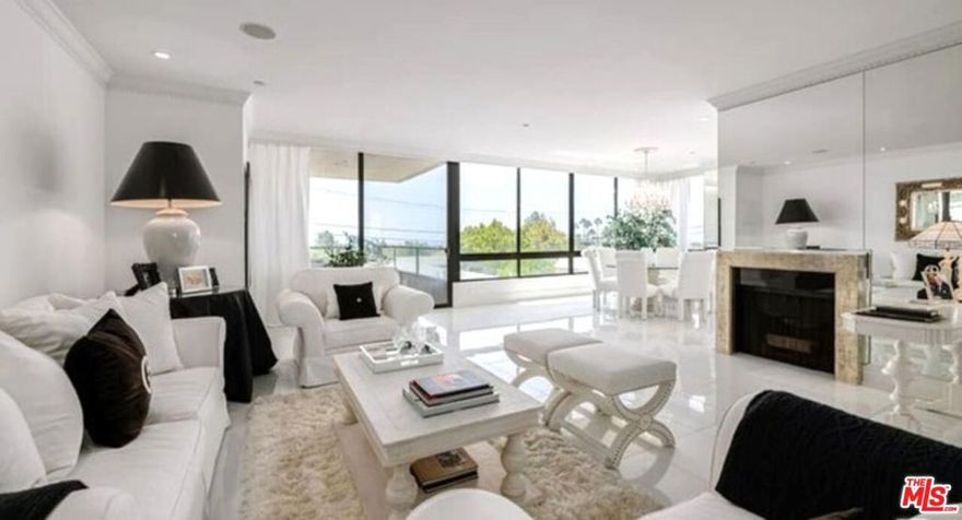 Rare SW corner unit in the exclusive Diplomat. A stunningly remodeled 2 bedrooms plus den condo with lovely city light and treetop views through large picture windows. A gracious formal entry hall w/a powder room that flows to a grand open living room with fireplace & dining area overlooking the sensational southern views and a large private balcony. Beautiful gourmet kitchen & breakfast area with plenty of cabinet and storage space. A large den which is perfect for relaxing, a home office or a third bedroom. A spacious & luxurious master suite w/ his & her walk-in closets & elegant master bath w/steam shower & large soaking tub. Second bedroom includes an en suite bath. Features include marble and granite finishings in the kitchen and baths, high ceilings w/in-ceiling speaker system in living room, dining area and den. Laundry room and dual AC units. 2 parking spaces w/extra storage, Pool and gym, 24-hour services. Sold completely Furnished.