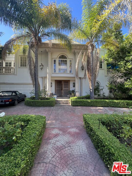 Beautiful gated estate set on one of the most desirable streets in the flats of Beverly Hills. The estate was exquisitely built with quality finishes and craftsmanship. The circular driveway leads you to your three car garage with ample storage. The estate is tired and needs a little TLC. This is an opportunity for a family to come in and make this home magical once again!