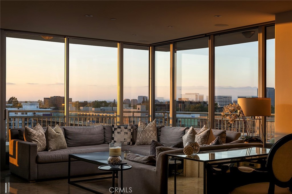 Welcome to an extraordinary opportunity to own a premier residence in The Plaza Irvine, one of Orange County’s most coveted high-rise communities. Perfectly positioned in the heart of Irvine’s thriving business district, this stunning 3-bedroom, 3.5-bathroom condominium offers over 2,600SqFt of single-level living space, masterfully designed for comfort, style, and sophistication. From the moment you enter, you’re greeted by a sense of refined elegance. The thoughtfully designed open-concept floor plan is ideal for both everyday living and effortless entertaining. At the heart of the home lies a gourmet chef’s kitchen, outfitted with top-of-the-line stainless steel appliances, sleek granite countertops, rich custom cabinetry, and a large island with bar seating—perfect for casual meals or hosting guests. The kitchen flows seamlessly into expansive living and dining areas, where soaring floor-to-ceiling windows invite in an abundance of natural light and frame sweeping panoramic views of the surrounding city skyline and vibrant urban landscape. Each of the three bedrooms serves as a private retreat, complete with its own en-suite bathroom, offering comfort and privacy for family and guests alike. The luxurious primary suite is a true sanctuary, featuring two generous walk-in closets, a spa-inspired bathroom with dual vanities, a deep soaking tub, and a separate glass-enclosed shower—designed to offer a tranquil escape at the end of the day. Additional highlights include a stylish powder room, an in-unit laundry room with built-in cabinetry, and ample storage throughout the home. Two secure, reserved parking spaces provide convenience and peace of mind, while smart-home features add a layer of modern convenience. As a resident of The Plaza Irvine, you’ll enjoy access to an unparalleled suite of resort-style amenities. These include 24-hour concierge and security services, a state-of-the-art fitness center, a resort-style pool and spa with cabanas, a beautifully appointed clubhouse with private lounge areas, a business center, and outdoor barbecue and dining spaces. Whether you’re working remotely, entertaining friends, or simply unwinding, every aspect of luxury living is thoughtfully catered to. Don’t miss this rare opportunity to own an exceptional residence in one of Irvine’s most desirable addresses