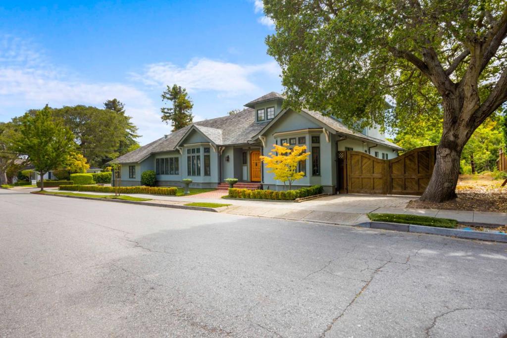 Custom-crafted French Country-style home built in 2001 on a large lot in highly desirable Easton Addition near Broadway, top schools and the beloved neighborhood library. The classic French Country façade has timeless curb appeal with a stucco exterior, slate tile roof, copper gutters and downspouts, true divided-light windows and an arched front door. Blending traditional elements with modern aesthetics, the sophisticated interior highlights quality materials and refined craftsmanship as seen in the box beam ceilings, oak floors with inlays, compound moldings, bay windows with transoms, custom cabinets and exquisite stone finishes. The two-level, open-concept layout comprises an elegant light-filled living room-dining room for gracious entertaining, a modern farmhouse-style kitchen and adjoining family room with French doors to a sweeping paver patio in a lush verdant setting, a primary suite that opens to the patio via double French doors, and two upstairs bedrooms, including a secondary suite with treetop views, and abundant finished storage space with creative options. Tasteful, refined and beautifully built, this home is in a highly desirable location near Broadway and Burlingame Avenues, top schools, parks and the Easton Addition Public Library