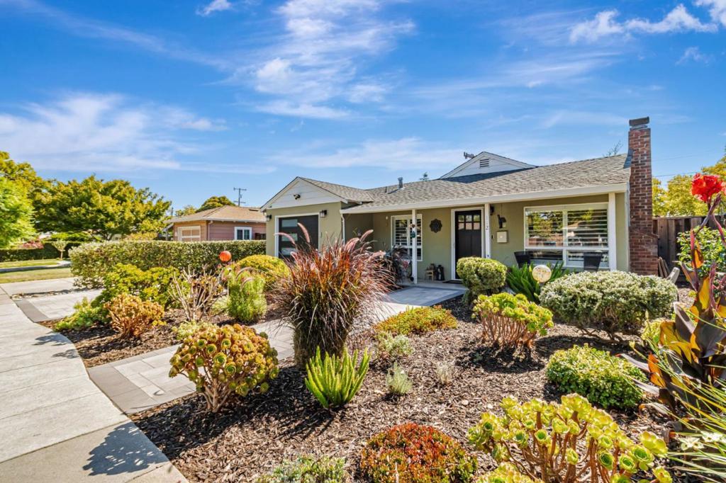 Welcome to this charming 3BD/2BA home in vibrant Redwood City. Spanning 1,450 sq ft, it offers an open layout with a cozy fireplace, exposed beam ceilings, skylight, and a kitchen featuring granite counters, stainless steel appliances, and an island. The home includes three bedrooms (one used as an office), a flex space, and a separate family room with abundant natural light and a custom bar with wine fridge. The spacious primary suite features high ceilings, a walk-in closet with custom organizers, and a spa-like bath with double sinks and oversized tub. The updated hall bath includes a stall shower. The flex room is perfect for a home office, gym, or playroom and leads to the family room and backyard. Outside, enjoy a level yard with patio, gazebo, BBQ area, artificial lawn, mature landscaping, and a fruiting orange tree. Additional features include owned solar panels, a one-car garage with laundry, new driveway pavers, new garage door, and updated window coverings. Conveniently located near downtown Redwood City, shopping, dining, and public transit.
