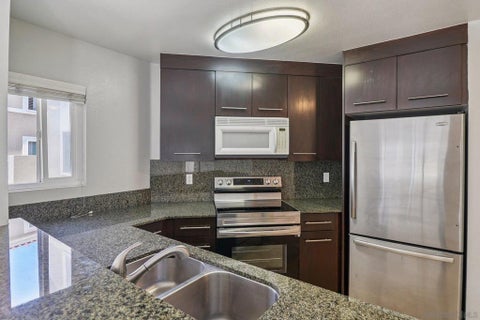 Photo of 7565 Charmant Dr Dr #505, San Diego, CA 92122 (MLS # 260021304SD)