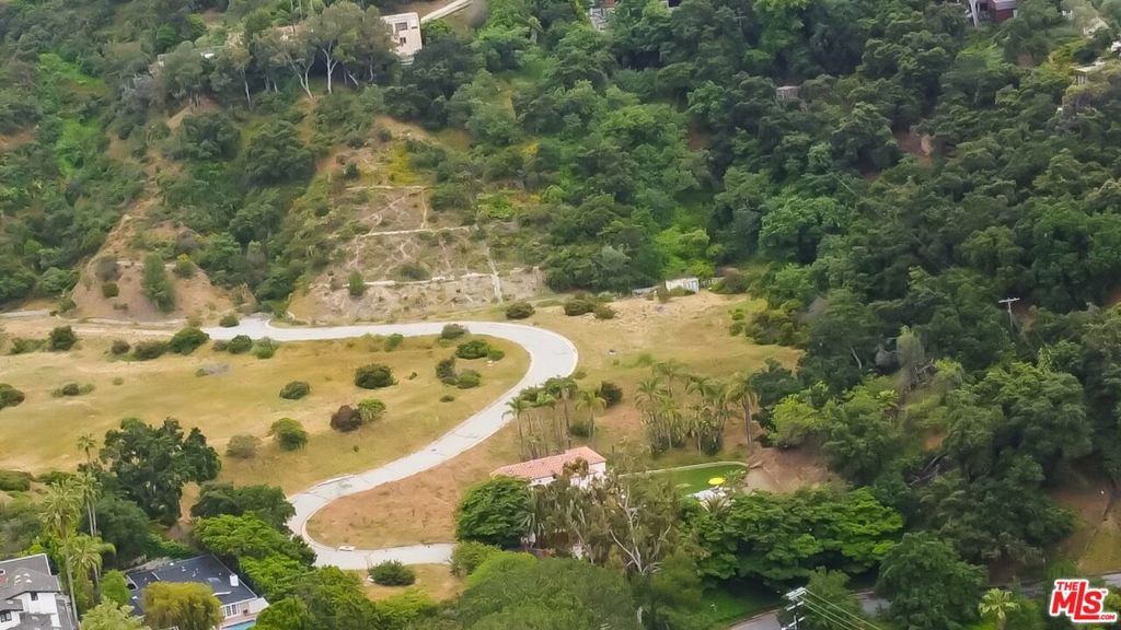 Nestled in the base of a verdant, private valley in Beverly Crest, is an opportunity to craft your dream home. This 4 acre, very buildable parcel sits up the hill, behind the gates of a private road. A previous appraisal states it is 65% buildable (2.6 acres) and is equipped with power, gas, water, and sewer connections. This extraordinary collection comprises four unique, separate, and buildable parcels, totaling 18 acres and are being sold separately or together. The parcels include: 4384-006-036, 4384-006-034, and 4384-006-035. Past architectural plans for four individual homes or one grand estate are available.
