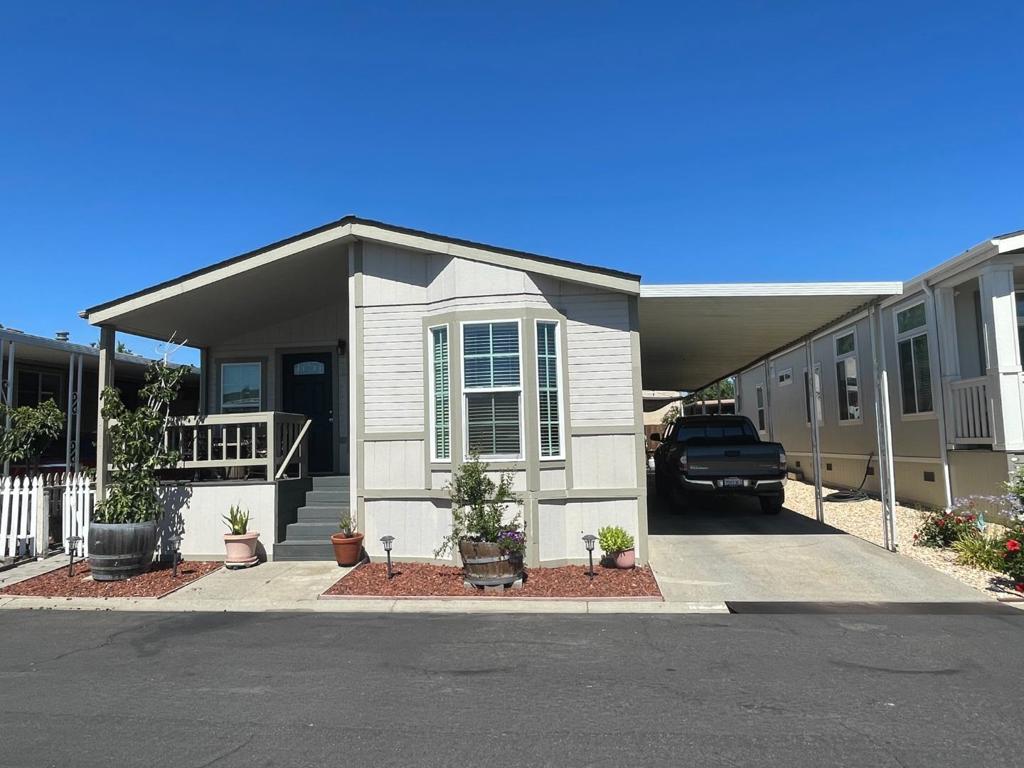 Beautifully Updated Home, excellent condition, double wide, 3 bedroom, 2 bath, kitchen has granite counters, ss appliances. Bathrooms have been updated. Floors are newer tile and laminate. Has fireplace. Has 2 car carport.