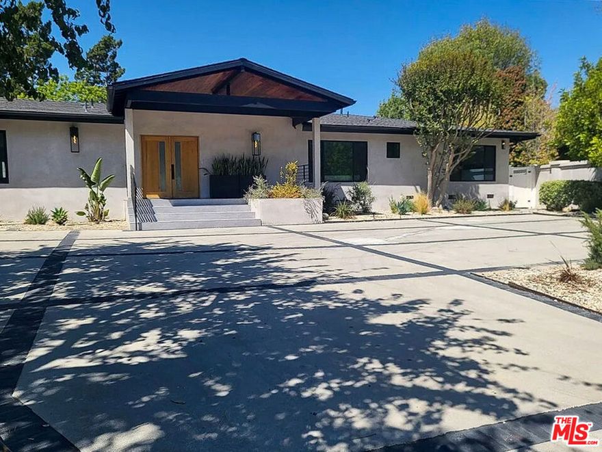 Step into luxury living with this stunning single-story retreat nestled in the heart of Encino, just south of Ventura Blvd. This home features 5 bedrooms, 4.5 bathrooms, and over 4,200 SQ FT of elegant living space. Gorgeous, engineered wood flooring, vaulted ceilings, and an open floor plan elevate everyday living. Gourmet kitchen with quartzite countertops, wine cooler, large waterfall island, Thor oven and gas range, and Dacor brand refrigerator, perfect for culinary adventures and entertaining guests. Whether you're working from home or enjoying leisure time, this property offers versatility and functionality. A bonus room off the kitchen is the ideal space for a game room, home office, home gym. Each bedroom is bathed in an abundance of inviting natural light, creating a warm and welcoming atmosphere throughout. The primary suite features a walk-in closet and en- suite complete with double vanity and relaxing rain shower. In addition to all the modern upgrades, this home is equipped with a Control 4 smart home system that connects to indoor speakers and exterior cameras. The backyard offers a sparkling pool complete with jacuzzi and Baja shelf, built-in BBQ, and spacious grassy area. Located near top public and private schools, popular restaurants and shopping destinations, parks, hiking trails, golf courses, and just minutes from the 101 and 405 freeways, this home offers convenience and connectivity within this highly sought-after Encino community. The house can be rented with or without furniture.