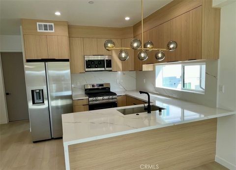 Photo of 611 W 41st Place, Los Angeles, CA 90037 (MLS # OC25262066)