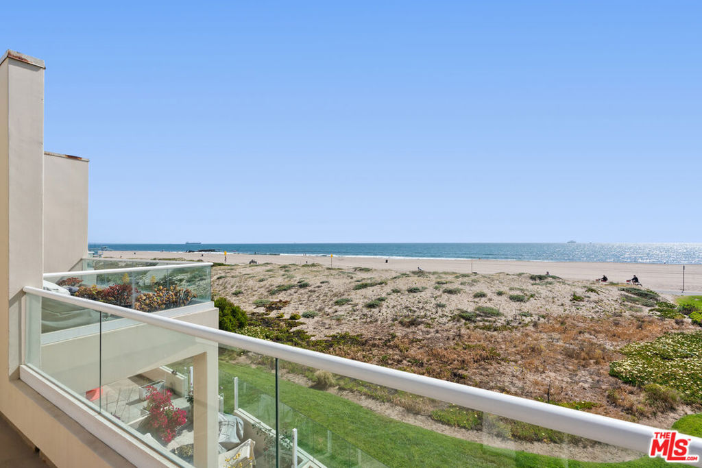 Privacy, patio, grass, sand dunes, bike path, beach, ocean waves, and spectacular sunsets. You're invited to a rare opportunity to own one of the best unobstructed beach view townhouses. This spacious retreat offers 2 bedrooms, 2.5 baths, and 1966 sqft and is now available at the exclusive Breakers gated community. Cook on stainless steel gas appliances and granite countertops. Have a drink at the charming breakfast bar or dine at your ocean-view table. Then, retreat into the sunken, bright, high-ceiling living room to relax with a gas fireplace and book. Upstairs, the large primary suite boasts stunning Southern California coastal views with pelicans, seals, migrating whales, and colorful sailboats. Awaken to the en-suite bathroom with dual sinks, bath, and glass shower. Get ready in your custom walk-in closet by California Closets. The guest suite includes an ensuite bathroom and generous mirrored closets. Additional amenities include in-unit laundry, side-by-side parking spaces and numerous guest parking spaces all in a secure underground garage including private storage. The Breakers enjoy resort-style amenities such as a heated pool, spa, fitness center, basketball court, clubhouse, and 24/7 gated security. Ideally located just minutes from shopping and restaurants in Marina del Rey and Manhattan Beach. Take a ride on an 18-mile+ beach bike path south to Palos Verdes or north around Marina del Rey, through Venice, and to the Pacific Palisades. This home offers the perfect blend of luxury, relaxation, and coastal lifestyle. Come, Live Life on the Beach.