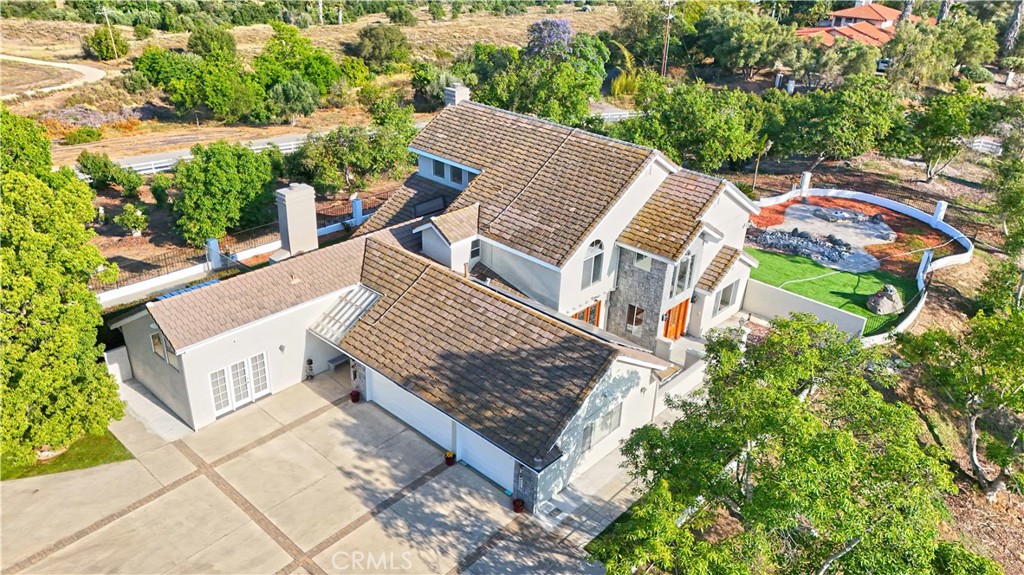 *DREAMS DO COME TRUE...RARE...LUXURY ESTATE ON OVER 5.46 ACRES WITH BREATHTAKING VIEWS!!!* Welcome to this spectacular hilltop estate on a large flat surface with panoramic views that will leave you Speechless! The Grand Entrance welcoming you home with a picturesque flower-lined driveway. This magnificent property boasts an avocado grove providing a serene and inspirational backdrop for your luxurious lifestyle.*LUXURY FEATURES* Gourmet Kitchen and Appliances; 4 Spacious Bedrooms, each a retreat in its own right; 4 Modern Bathrooms showcasing meticulous attention to detail; Upgraded Countertops and new flooring, adding a touch of elegance to every room; Central heat and air with 2 fireplaces ensuring a comfortable living environment year-round; *EXPANSIVE Patio offering panoramic views and ideal setting for outdoor entertaining or relaxation; The patio offers the perfect place to sit with a cup of coffee while watching the fog roll off the hills; Enjoy stunning sunrises and sunsets from these expansive outdoor spaces; *PRIVATE OASIS* Feel a sense of awe and wonder from the comfort of your own home; Experience the serenity of hilltop living, surrounded by natures beauty; Perfect for an Equestrian property, Nature lovers, Farmers or those seeking a unique opportunity; Large avocado grove providing a tranquil oasis and potential for income generation. There is opportunity to expand avocado grove to make it more productive. Property is located approximately 10 minutes from Fallbrook! Paid for solar system and EV charger. *DONT MISS OUT ON THIS INCREDIBLE OPPORTUNITY* Schedule a viewing today and make this luxurious estate your DREAM HOME!!!