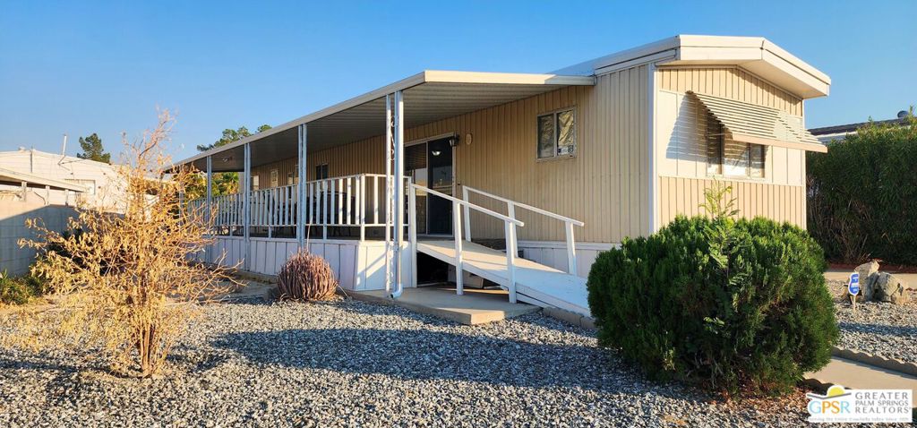 Discover an affordable gem in Desert Crest Country Club! This cozy and furnished 2-bedroom, 2-bath home offers 672sqft of easy-care living with peek-a-boo mountain views and a versatile covered patio for relaxing or entertaining. Enjoy the convenience of a covered carport and a handy washer/dryer located in the exterior shed. The home is move-in ready, yet offers plenty of potential to add your own personal touches. Ideal for buyers seeking value in an active 55+ community with resort-style amenities including a mineral spring pool, hot spas, golf course, and clubhouse. This inviting retreat won't last long!