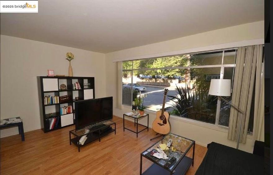 Discover your next academic haven! Nestled just a heartbeat away from the vibrant UC Berkeley campus (south side), this sunlit 700 SqFT unit offers the ideal blend of serene residential living and scholarly buzz of college life. The apartment boasts 2 spacious bedrooms with ample closet space for all your needs. The heart of the unit is the open-plan living room, seamlessly integrating a modern and cozy kitchenette. It's the perfect spot to unwind and enjoy its generous layout. The large windows bathe the space in natural light, framing views of the picturesque neighborhood. The unit features well appointed spacious and functional bathroom. And for those moments when you need a breath of fresh air, the scene outside your window dotted with lush trees and the iconic Berkeley hills in the distance. Close to everything: campus, Telegraph Ave stores, College Ave., Clark Kerr Campus, and more. Great space and great location! The owner is nearing completion of electrical upgrades throughout the entire building.