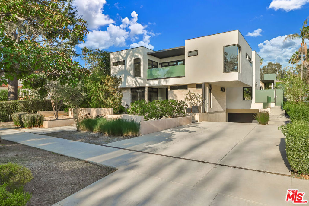 COMING SOON! This very cool and contemporary architectural gem is a work of art! Look no further as this truly custom curated design offers everything and more. Upon entering you are greeted by the open and sun filled floor plan, graced with plenty of natural light. The expansive living room features 18 foot ceilings, generous sized windows , and expansive glass doors that open to create the California lifestyle. Cooking is enjoyed in everything a chef would wish for and more.Top of the line appliances include dual Bosch dishwashers, 6 burner Wolf cooktop, double ovens, a wine refrigerator, and pantry. Prep and hang out around the newly refreshed gorgeous quartzite, double waterfall central island. Choose to dine indoors in your formal dining room, or al fresco, poolside in your outdoor dining area with newly installed outdoor heaters. Enjoy visits or solo time along your outside fire pit within the lush grounds. The Main floor is graced with two downstairs rooms perfect for a home office and guest/media room. No need to travel, as once you arrive to the second floor you have been elevated to the generous sized primary suite. This suite is situated with a serene spa-like bathroom graced with a soaking tub, dual shower heads, Toto fixtures. Sip coffee, or beverage, and enjoy the private balcony off the primary suite overlooking the park like landscape. The secondary floor affords two additional bedrooms with one newly done en suite bathroom perfect for those family and friends. The second floor laundry room with cabinets, and sink provides convenience as well. No need to check out, but when you must, descend to the FIVE car, over-sized garage, it is a Car Collector's dream! This newly polished garage floor with EV charge point, is ideal for secure direct access parking, a home gym, an art studio or both. This very cool compound covers all the bases and includes solar panels, a security system, and three a/c units. Rest assured that many upgrades have been recently done such as new a/c , new water heaters and a new roof coating. An absolutely unique jewel is all situated on a generous sized, approximately 8,966 square foot lot in the highly sought after Gillette Regent Square. This modern estate is all located close to the trendy Montana shops, schools, dining nearby beaches, and the famous Santa Monica Pier. Once you are inside, you are Home!