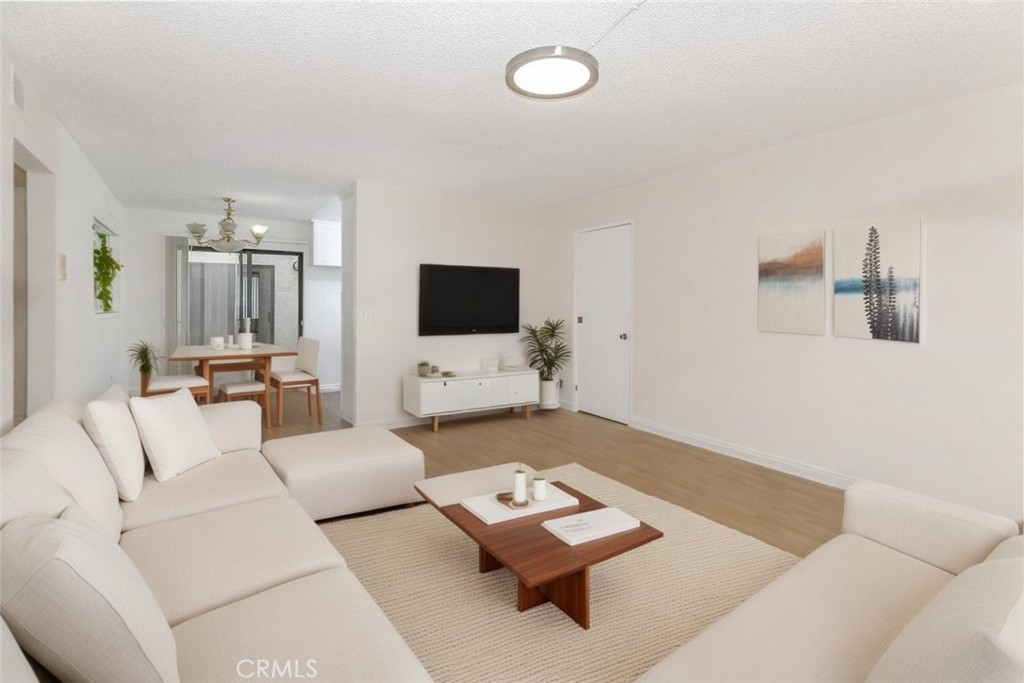 Back on the Market! Bright and updated 2-bedroom, 2-bath residence in the heart of Glendale. Features include an open floor plan with laminate flooring, spacious living area, dining nook, and remodeled kitchen with sleek cabinetry, quartz countertops, and modern finishes. Primary suite offers en-suite bath and large mirrored closets. Both bathrooms upgraded with contemporary tile and fixtures. Includes two assigned parking spaces, ample storage, and a well-maintained community. Conveniently located near shopping, dining, and freeway access.