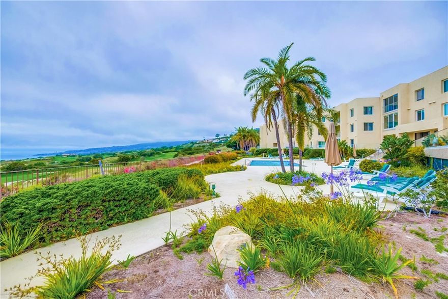 Resort living at its finest! You'll feel like you're on vacation every day while enjoying the fabulous PANORAMIC VIEWS of the ocean, Catalina Island, lush golf course, coastline, rolling hills and magnificent sunsets from this highly upgraded & modern 2-bedroom, 2-bath condominium located in "Ocean Terrace." Spacious enclosed deck offers the perfect setting for that evening glass of wine or morning cup of coffee watching the pelicans glide through the cool ocean air and sailboats heading to open seas. Spacious living room has a modern fireplace, smooth ceilings, indirect lighting and fabulous modern grey-hued wood-look flooring throughout. The high-gloss white kitchen has custom decorator tile subway backsplash and beautiful quartz countertops, high-end stainless appliances and offers plenty of storage. The primary suite has a spacious walk-in closet and remodeled full bath with oversized shower and bidet. The adjacent guest bedroom has a full bath, and the washer and dryer are located in the hallway adjacent to the bedrooms. Ocean Terrace is located in the highly desirable Palos Verdes South neighborhood on a cul-de-sac overlooking a breathtaking National Golf Course & hiking trails that span thru PV coastline, private beaches & magical coves & the 5-star Terranea Resort. Ocean Terrace amenities include a spacious swimming pool, jacuzzi, two tennis courts, pickleball/paddle tennis court, shuffleboard, fitness center, sauna, billiard room, recreation room with a large screen TV, kitchen and restrooms.... everything you'll need to enjoy resort-style living including beautiful hiking trails along the ocean bluff. Enjoy the beautiful sunsets from your piece of paradise along the coastline of Palos Verdes!