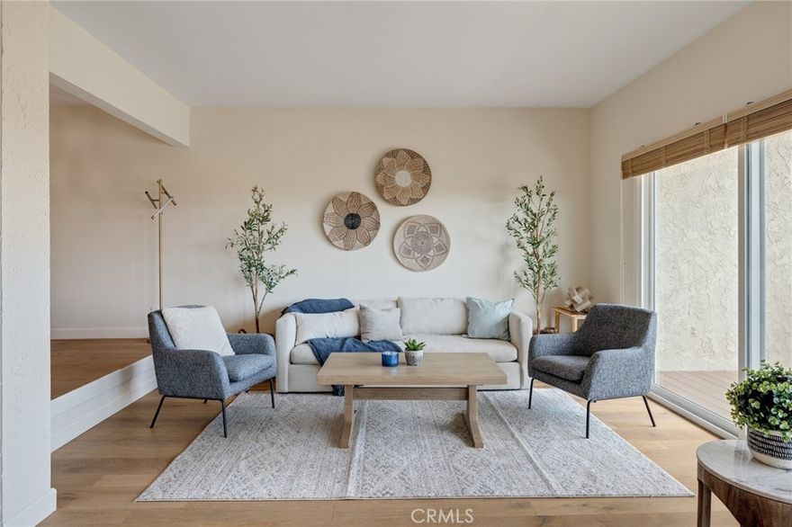 Welcome to 58 Hilltop Circle — this end-unit townhouse that takes “location, location, location” literally. Perched atop "The Hill," this 3-bed, 2½-bath home delivers eye-catching city-light, ocean and Queen's Necklace views via a wrap-around balcony — the perfect backdrop for morning coffee or evening downtime. Inside, vaulted ceilings, a designer fireplace, and gleaming oak engineered floors meet updated kitchen comforts, a formal dining room, and a relaxed breakfast nook. Upstairs, the master suite truly shines with dual walk-in closets and a private balcony to savor the twinkling skyline. The 2-car garage with extra storage is conveniently attached, and guest parking is directly adjacent, arguably touting this unit as one of the best locations within the complex. Outside your door — a gated, resort-style complex with tennis courts, pool, jacuzzi and lush landscaping. Minutes to top PV schools, shopping, eateries, the beach and coastal parks and trails and so much more— this townhome wraps comfort, style, and location into one sweet, high-impact package. A new roof, termite completion and other upgrades were just completed November 2025.