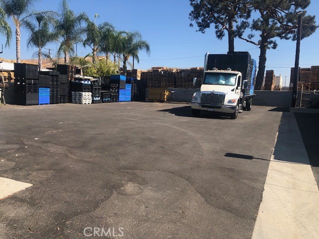 Location, Location, Location in Pomona one Block from Holt Avenue, has many available rooms, two bathroom and plenty cabinets, single garage, new paint in and out, large space for parking or can be used for any type of business that you maybe desired. Block  wall all around, automatic from gate that face the street  to enter in and out of the property.