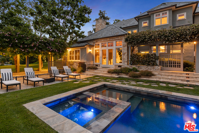 The ultimate lake house. Custom built Traditional by Thane Roberts AIA and landscape design by Pamela Burton -published in Garden Landscapes. Perfectly positioned on the largest site on Toluca Lake and the former site of the WC Fields estate. Over 120 feet of frontage along the most desirable sweeping curve of Toluca Lake Ave. Two story foyer offers immediate views out to the lake. Elegant living room with detailed moldings and stone fireplace, cozy dark wood paneled office with intricate plaster ceiling & fireplace. Casually elegant family room with vaulted wood beamed ceiling and fireplace, chef's kitchen, and breakfast room. Full guest suite on the main level. Spacious master suite featuring fireplace, dual baths, and walk-in closets + 3 additional bedrooms. Stone bar-b-cue, pool, grassy lawns, and lower lakeside sitting area with fireplace, and dock. A magical spot that must be seen to appreciate. Endless entertaining possibilities. Minutes away from several major studios.