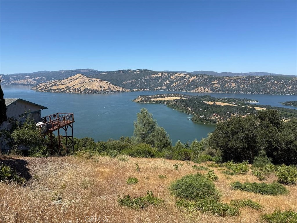 Huge views of Clear Lake and Buckingham peninsula from this half-acre parcel. Septic approval on file and limited water hookups available, first come first serve. Looking for more space, adjacent lot at 7530 Evergreen also available! Enjoy Riviera Heights ownership with its clubhouse, pool, and marina with boat launching, fishing, picnicking and a swimming lake front!