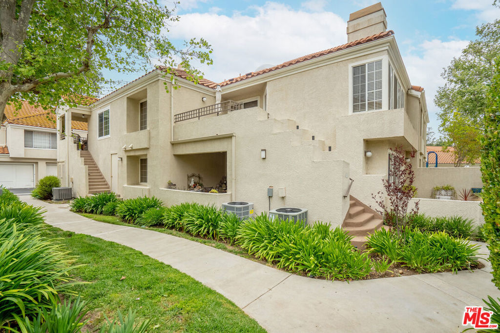 Perfect location and stunning views! This beautifully updated 2-bedroom, 2-bath corner end townhome is nestled in the desirable gated community of Steeplechase in Calabasas. Enjoy breathtaking views of Malibu Creek and the Santa Monica mountains from this light-filled second-story unit. The open floor plan features soaring atrium windows, a private patio, and a modern kitchen with stainless steel appliances. Recently renovated with new engineered wood floors and stylish bathrooms, this home is move-in ready. The upstairs loft can be enclosed to create a third bedroom or office. With resort-style amenities including two pools, a spa, sauna, gym, and clubhouse, this home combines luxury and convenience in one of Calabasas's most sought-after locations. Don't miss out on this incredible opportunity!