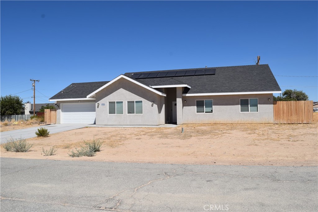 2020 Built - Modern & Spacious Home with RV Parking! Welcome to this beautiful 4-bedroom, 2.5-bath home with a versatile bonus room, offering plenty of space for today's lifestyle. Built in 2020, this home features an inviting open floor plan with upgraded bathrooms and stylish finishes throughout. The heart of the home is the open kitchen, complete with quartz countertops, abundant cabinetry, pantry, and a seamless flow to the living and dining areas—perfect for entertaining. A separate dining room provides additional space for gatherings or bonus room. The large primary suite is thoughtfully situated on the east side of the home, away from the other bedrooms for added privacy. It features a spacious walk-in closet and a custom-tiled ensuite bath. Three additional bedrooms share a full bath, making it ideal for family or guests. Enjoy the outdoors with a fenced backyard featuring a covered patio, artificial turf, and concrete hardscape—perfect for relaxing or entertaining year-round. RV parking adds extra convenience for all your toys and travel needs. Additional highlights include a two-car attached garage, modern design, and move-in ready condition.