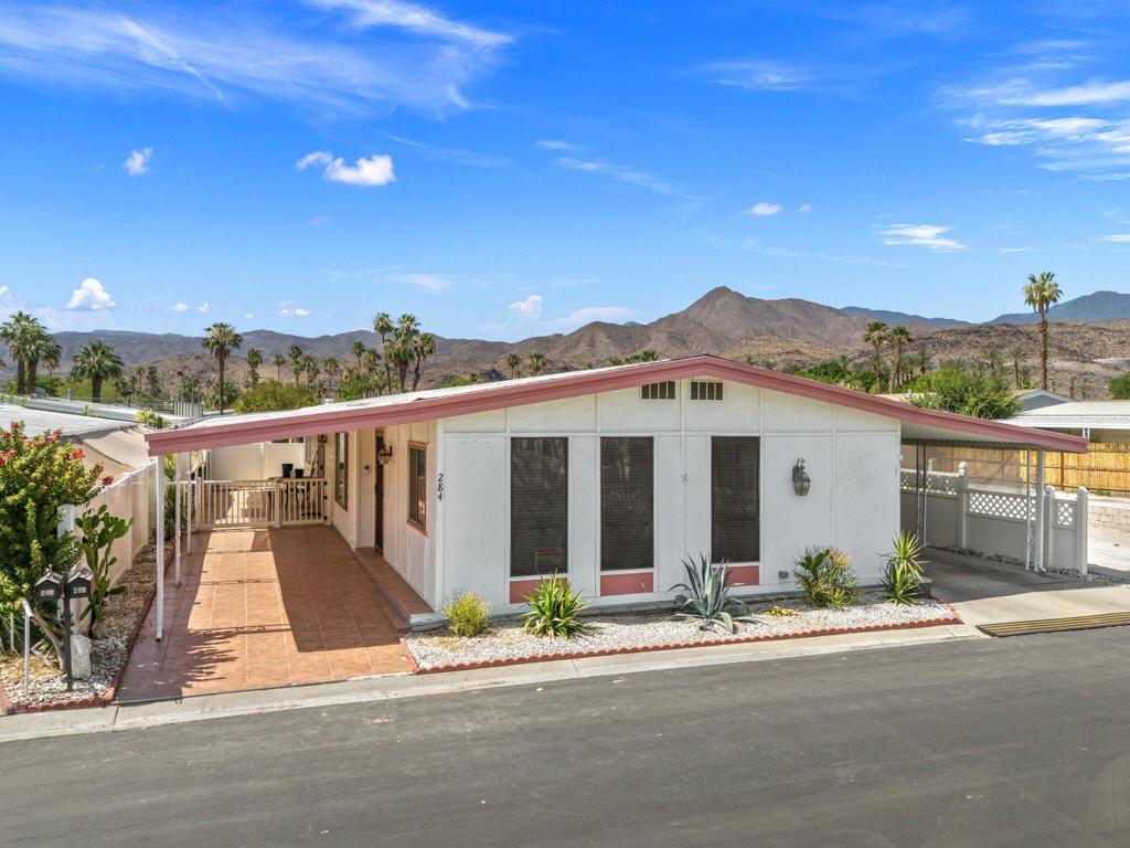 MOVE IN READY, Palm Springs, You Own the Land. Central to everything, walk to Traders Joes, Restaurants, Shopping and easy access to Airport. Downtown is mere minutes on E. Palm Canyon Dr. You will love this Quintessential Palm Springs Home. Tasteful colored walls, LVP flooring, tile in bath. Covered Patio with tile and desert landscape, fenced for pets, great area for all season entertaining. Bedrooms are on either side, for privacy, extra large Laundry area with sink and storage. Arched doorways, skylights, you are going to be impressed with this home.55+ Active Community with HOA that covers Clubhouse, gym, two Pool/Spa, Tennis courts, RV parking, trash and water included. This one will say to you and friends, ''I live and love Palm Springs.''