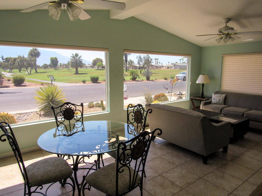 Experience the stunning view of Mountains and the Golf Course Hole #16 from the living room and breakfast nook. The upgraded kitchen with granite counter tops also enjoys the view of the golf course. Adjacent to the kitchen is a formal dining room. A separate TV room is conveniently located off the living room and dining room. The spacious 270 sq. ft. Master Suite which was added, brings the square footage of the home to1,710 sq. ft. The addition was approved by the ARC committee of Palm Desert Greens Country Club and is on file. The Master Suite has a golf course view, walk-in closet, an office area, dual sinks and walk-in shower. The floors have tile and laminate flooring for easy upkeep, and the dual pane windows are decorated with energy saving Duette window coverings. The tile patio is great for entertaining and has the direct view of the golf course. Call for a tour of this stunning view home!