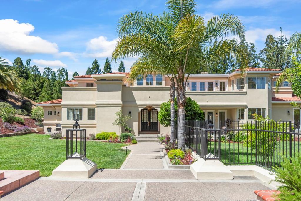 Welcome to this elegant Mediterranean Villa in exclusive Mt. Eden Estates on a private acre, amid panoramic hills & boutique vineyards. Palatial 4809 sqft 5 bedroom 4.5 bath home w ideal flexible floor plan for todays multi generation family. 2 en-suite bedrooms downstairs and grand primary suite & additional 2 bedrooms upstairs* Grand foyer w dramatic high ceilings & gallery-like hallway. Elegant designer upgrades through out home*Bright&open floorplan*Elegant spacious living room w fireplace. Large formal dining room - perfect for entertaining! Spacious Gourmet kitchen w new custom countertops & flooring, multiple gas cooktops, & 2 dishwashers, Ideal for multiple chefs in kitchen! Level acre w private enclosed front yard & patios. Informal dining overlooks garden w fig/orange/plum/pomegranate/apple trees. Family room w fireplace. Luxurious primary suite w fireplace,+walk in closet . Park like backyard w large patio & expansive lawn - Perfect for entertaining friends & family, playing sports, or a great site for a pool/outdoor kitchen or ADU. This estate is truly the quintessential indoor-outdoor California living*Your tranquil escape within minutes of Downtown Saratoga, Mountain Winery, excellent Saratoga schools & Silicon Valley.