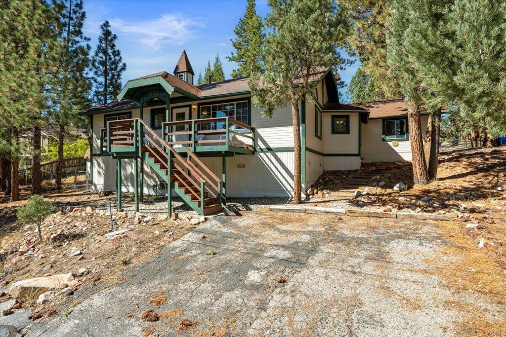 Nestled on a prime corner lot in the coveted Whispering Forest neighborhood of Big Bear City, this beautifully maintained single-level retreat offers the perfect blend of serenity and accessibility. Inside, you will find 3 spacious bedrooms, 2 bright full baths, with a designated laundry closet in the hall. Enjoy an oversized kitchen with abundant cabinetry, plenty of counter space, and direct garage access. The spacious living room features vaulted, beamed ceilings and expansive windows to flood the living space with natural light. Cozy up to your beautiful brick fireplace with raised hearth on those chilly mountain evenings. Fantastic outdoor appeal set on a desirable large corner lot surrounded by a mix of mature and young pines with ample guest parking in front and in the driveway by the garage. Large storage shed in the back for all your gear. Covered front entry deck and spacious rear deck ideal for dining al fresco or relaxing under the stars. Whether you're seeking a full-time mountain haven or a weekend escape, this move-in ready home delivers comfort, charm, and location. Come enjoy the mountains with crisp autumn mornings, snowy winter nights, and sun-drenched summer afternoons- all just minutes from the ski slopes, lake, and Village with tons of hiking trails nearby. You won't want to miss it!