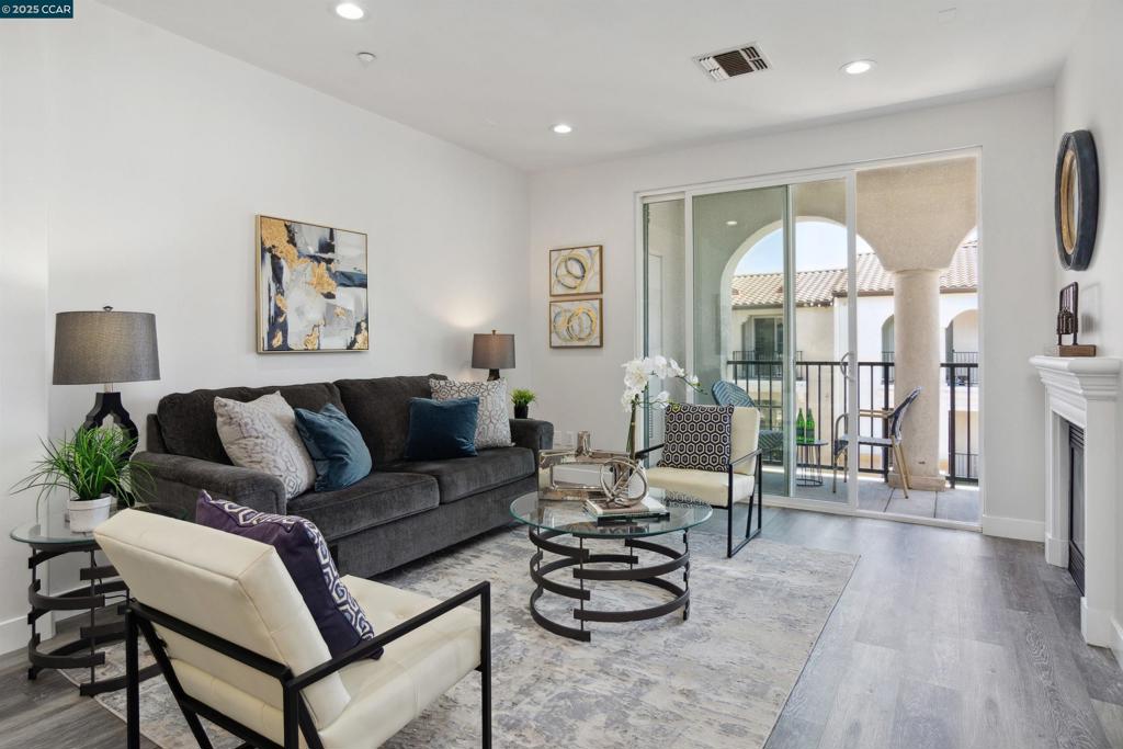 Exceptional top-floor end-unit condo w/contemporary design. $50K of updates inclds all new stainless appls, flooring, interior paint, bthrms, fixtures, blinds. Located in The Terraces at Dublin Ranch a luxurious 4-story gated community around inviting courtyards, fountains, gardens and resort-style amenities incldg pool, clubhouse w/frpl & kitchen, fitness center, elevator access to each floor, secured parking & in-unit GE washer/dryer. 1246+/- light-filled SF. East & south-facing views. Central AC. 3 bdrms. 2 bths. inclds primary suite w/walk-in closet. En suite w/porcelain tile floors, dual-sink vanity, sliding glass shwr dr. Spacious living & dining area. Switch-operated gas frpl. Recessed niche for media cabinetry. Slider to 500+/-SF balcony overlooking gardens, courtyard. Kitchen w/stainless sink, granite counter, bksplsh, bkfst bar. 2 bdrms share full bth w/tub/shower combo. Adjacent to 5-acre Bray Commons Park w/bbq grills, picnic areas, basketball & volleyball courts, playground, walking paths. The East Dublin location is within a mile of Fallon Gateway shopping & restaurants and top-rated K-8 schls. Walk to the new Emerald High Schl. Near SF Premium Outlets, Fallon Sports Park. Los Positas College, less than a 6-mile drive. Convenient access to freeways & BART station.