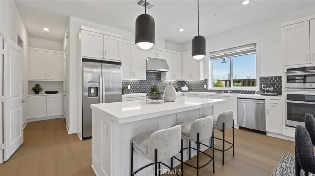 This new two-story townhome boasts a modern layout with an open-concept floorplan on the first level. A
convenient den is located off the entry, providing a convenient space to focus or relax. Four bedrooms are
located upstairs, including the lavish owner’s suite offering access to a spa-inspired bathroom and
generous walk-in closet.