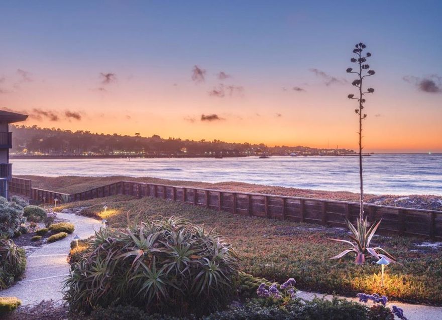 Welcome to 19 La Playa where the ocean is your neighbor and the sand is just 20 feet from your front door. Perfectly placed in the heart of Del Monte Beach, this rare 2-bedroom, 2.5-bathroom coastal condo offers the ultimate in beachfront living. Step outside and walk the beach all the way to local restaurants, breweries or the famous wharf! - No roads, no cars, just your bare feet and pure shoreline bliss.   The unobstructed sunset views make this unit truly special.  The kitchen has been nicely updated with all new appliances & granite countertops.  The dining, and living areas flow seamlessly together to create warmth and comfort, perfect for entertaining or cozy nights next to the fireplace with books.  The primary bedroom feels like a private retreat with southwest facing harbor ocean views that lead to a full bathroom ensuite.  Or work from home in the office/2nd bedroom.   All surrounded by comfort and silence, even with the close proximity to the navy school, downtown Monterey, the freeway or MOGO urgent care.  Whether you're sipping coffee on the balcony or strolling the surf to all of the local Monterey attractions, 19 La Playa is more than a home its a lifestyle. It is coastal California at its most effortless and most beautiful.   Live the dream. The beach is calling.
