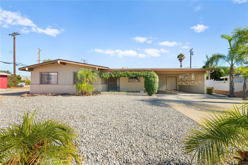 Welcome to this charming 3-bedroom, 2-bathroom home located in the desireable 55+ Community of Sun City in Menifee! With low taxes and a low HOA this property offers an excellent opportunity for comfortable living. Spanning 1,450 square feet, the home's spacious floor plan is filled with natural light.The property is situated on a generous 12,632 square foot lot, providing ample outdoor space for anything that you can dare to imagine! The main living area has a beautiful picture window that is reminiscent of a mid-century modern design. Additional features of the home include a walk-in tub, an extra (interior) screened-in porch, a dedicated laundry room, a bonus room off of the garage perfect for a workshop or crafting space, and a water feature that provides ambiance for a relaxing afternoon under the large (exterior) patio cover. Plus, with a two-car carport that can easily be converted into a full 2-car garage, you'll have plenty of parking and storage options. Enjoy the benefits of the community amenities, including two inviting pools, lawn bowling, chair volleyball, and various other social clubs and activities that cater to a vibrant lifestyle. This home combines comfort and convenience in a wonderful community. Call to schedule a showing today!