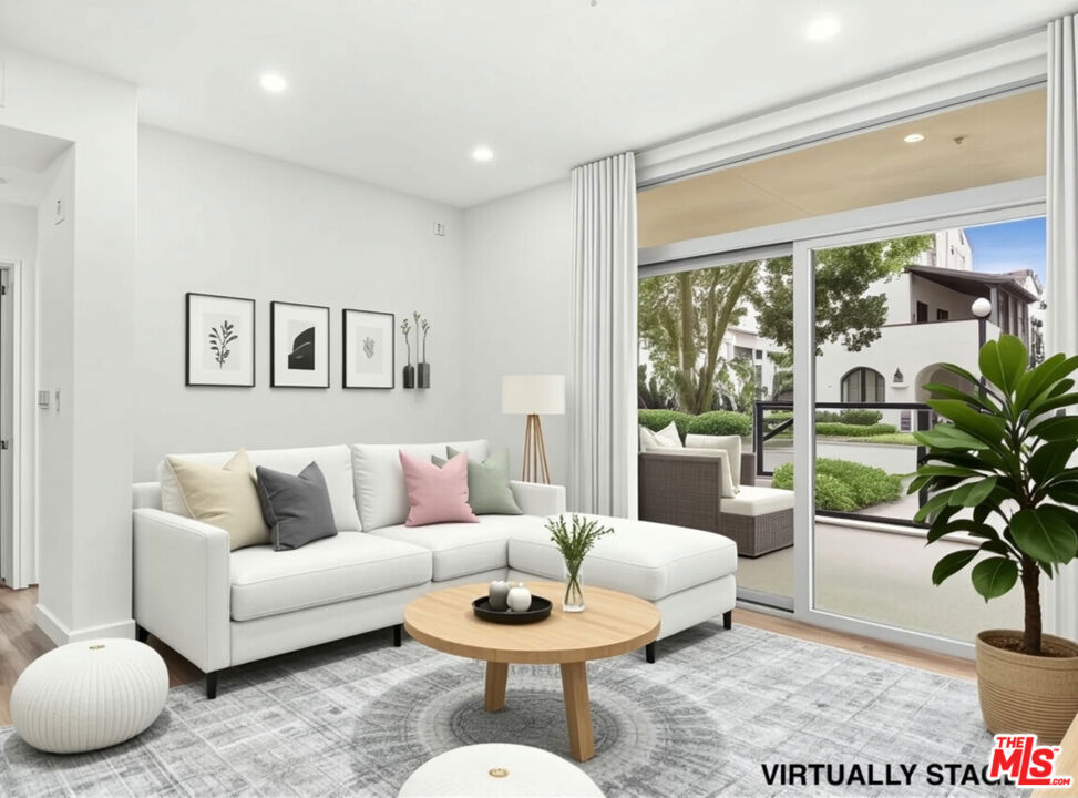 Welcome home to one of Playa Vista's most inviting and desirable residences. This contemporary single-level corner unit with a rare street-facing walk-up feels more like a private home than a condo, perfect for those who love being steps from parks, shops, dining, and everything this vibrant community has to offer. And if you have a dog, you'll especially love the easy access to green space and walkable paths right outside your door. Step inside to a bright, open layout featuring 2 spacious bedrooms, 2 bathrooms, and a versatile Den/Flex Room, great for a home office, playroom, or guest space. With 9-foot ceilings, floor-to-ceiling windows, and luxury vinyl plank flooring, the space feels light, fresh, and welcoming. The kitchen is a delight to cook in, with granite countertops, stainless steel appliances, and a breakfast bar that's perfect for morning coffee or casual meals. On opposite sides of the home, the bedrooms offer privacy and comfort, each with walk-in closets, new carpet, and their own patio accessideal for relaxing with a book or enjoying the breeze. You'll love the oversized covered patio with direct street access, perfect for entertaining, outdoor dining, or simply soaking in the neighborhood energy. Other thoughtful touches include a full-size washer/dryer with custom shelving and two individual secured parking spaces. Enjoy everything Playa Vista has to offer, including The Resort and The Center Pointe Club, featuring multiple pools, state-of-the-art gyms, parks, sports courts, soccer fields, playgrounds, dog parks, and more. A short stroll or PVCS Bus ride takes you to Playa Vista Elementary, Concert Park, and Runway Village, home to shops, restaurants, entertainment, Whole Foods, CVS, and medical offices. This is more than just a home, it's a lifestyle. Come experience the best of Playa Vista living at The Promenade!