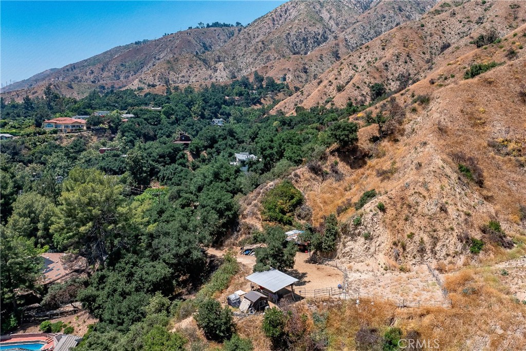 Rare opportunity to build two homes in Pasadena Glen! These two lots are offered together at this one price. With a combined area of almost one acre, there are very few land properties of this size available near LA. This lovely neighborhood was not affected by the Eaton Fire and retains its lush country feel. Nearby homes have mature green trees and landscaping. Despite being up in the hills away from it all, stores like Whole Foods are only a 10-minute drive. The first parcel, APN 5760015026, is approximately 0.42 acre and shares a gated paved driveway with the home at 3555 Shaw Ranch Rd to the west (not owned by the seller). That will save you money! Back in 1998, the previous owners poured a foundation, which remains. Buyers can investigate using the existing foundation or start anew. Detailed plans and reports for APN 5760015026 will be posted in the coming days. The adjacent lot to the east, APN 5760015021, is approximately 0.55 acre and has a flat open area, making it easy to build here. There are rescue horses on this lot. We invite you to walk both lots at any time; however, the seller kindly requests that you refrain from parking in the driveway, blocking the street, entering the pen, or feeding the horses. There is a voluntary HOA that charges just $75 annually, but no restrictive HOA-type rules here. Allowed uses are governed by county zoning, which is R1 Residential on both lots. Electricity and water are available. Septic needed. The listing agent has no information about building. Buyers will want to consult with their architect, builder, and the county (not the city) regarding all matters related to permitted uses and development. The owners will also consider selling either lot separately.