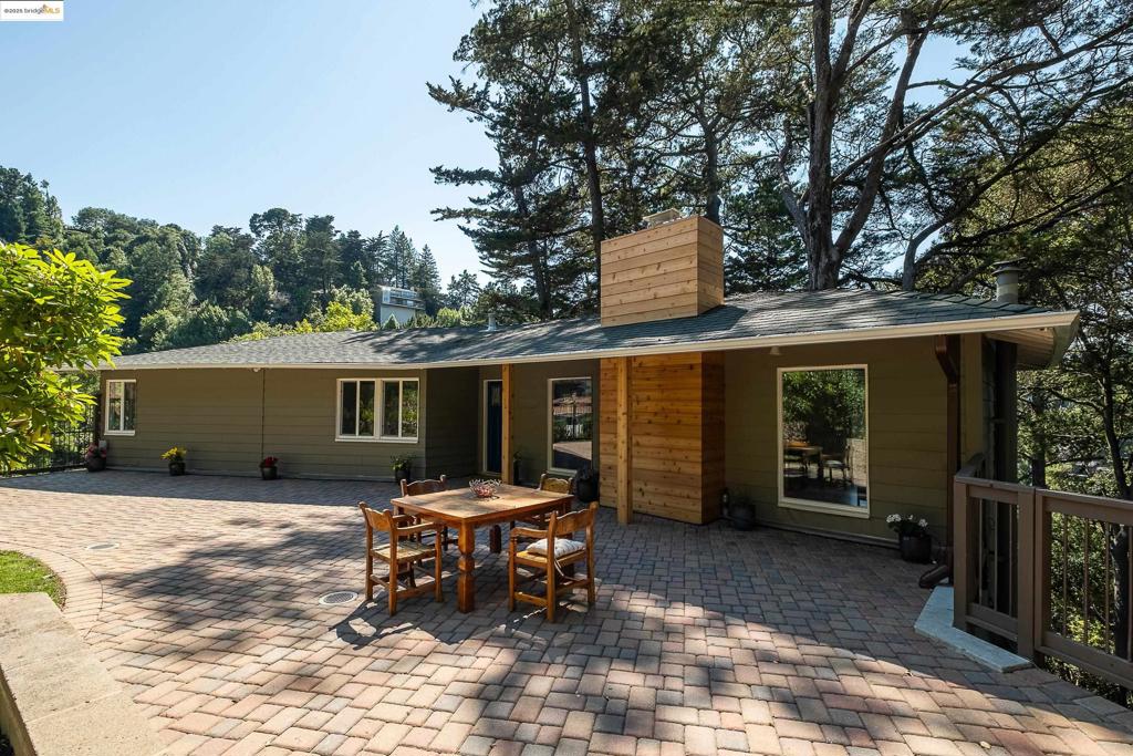 On a quiet street in the heart of Montclair, this beautifully remodeled 4-bedroom, 2-bathroom home is sure to captivate. As you approach the property, you'll notice an extra spacious driveway with ample parking for guests, along with a two-car garage. On this level, you'll find a large master bedroom featuring a walk-in closet, double sink bathroom with jet spa and a shower, and a spacious bonus/laundry room complete with a washer and a gas dryer hookup. Step outside to a large Trex deck, which can be accessed from both the driveway and the master bathroom, as well as an additional lower yard where you can savor the views and enjoy the outdoors. The upper level boasts a flat front yard that is beautifully landscaped with pavers and grass, featuring a mature and captivating garden. On this level, there are three additional bedrooms and a full bathroom. Upon entering the foyer, you’ll be greeted by an open floor plan that includes a well-appointed kitchen equipped with stainless steel appliances and a new countertop, a dining room, and a large living/family room with a beautiful fireplace. Many windows allow for stunning views of the surrounding outdoors including the beautifully landscaped front yard. Broker does not guarantee the accuracy of sq ft, zoning, etc.