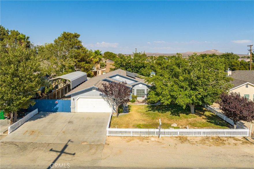 Welcome to your California dream home featuring covered RV access with a 40-ft RV cover! This immaculate residence, built in 1991, is nestled in the heart of California City and offers the perfect blend of comfort, modern amenities, and eco-friendly living. The home boasts three spacious bedrooms and two full bathrooms, providing ample room for relaxation and entertaining. Embrace sustainable living with solar panels and a backup battery system—allowing for energy savings and peace of mind during power outages. The buyer will assume the current solar contract at just $0.201/kWh and $54 per month for the battery. Enjoy year-round comfort with the newly installed 4-ton HVAC system, ensuring efficient heating and cooling throughout. Ceiling fans in every room enhance airflow and keep the home comfortable on warm California days. The upgraded kitchen features beautiful granite countertops and modern stainless-steel appliances, making it a true delight for any home chef. All ducts have been recently cleaned, promoting fresh indoor air quality. Additional highlights include a convenient city sewer connection, eliminating the need for septic maintenance, and a spacious layout ideal for everyday living. Perfectly maintained and move-in ready, this home offers the best of California City living—featuring modern upgrades, energy efficiency, and ample space for all your outdoor adventures. Don't miss your opportunity to make this beautiful home yours today!