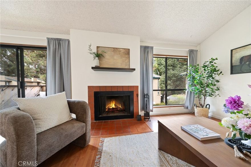 Location! Location! Location! Walk to downtown in minutes! Enjoy a short walk to downtown & farmers market or your favorite restaurant! Welcome to this inviting 2-bedroom, 2-bathroom condo located in the highly sought-after Mission Gardens development. Designed for comfort and convenience, this upper-level unit features vaulted ceilings and large windows that fill the space with natural light, creating a bright and airy atmosphere throughout.  Enjoy easy living with durable vinyl flooring, a private balcony perfect for morning coffee or evening relaxation, and the convenience of in-unit laundry. The open-concept layout flows seamlessly from the living area to a functional kitchen and dining space—ideal for everyday living or entertaining guests.  The primary bedroom includes ample closet space and an en-suite bathroom, while the second bedroom is perfect for guests or a home office.  As part of the Mission Gardens community, residents have access to a range of amenities, including a sparkling pool, spa, and a welcoming clubhouse—perfect for socializing or relaxing. The development is well-maintained, with landscaped grounds and a peaceful neighborhood feel.  Conveniently located near shopping, dining, parks, and commuter routes, this condo offers both lifestyle and location.