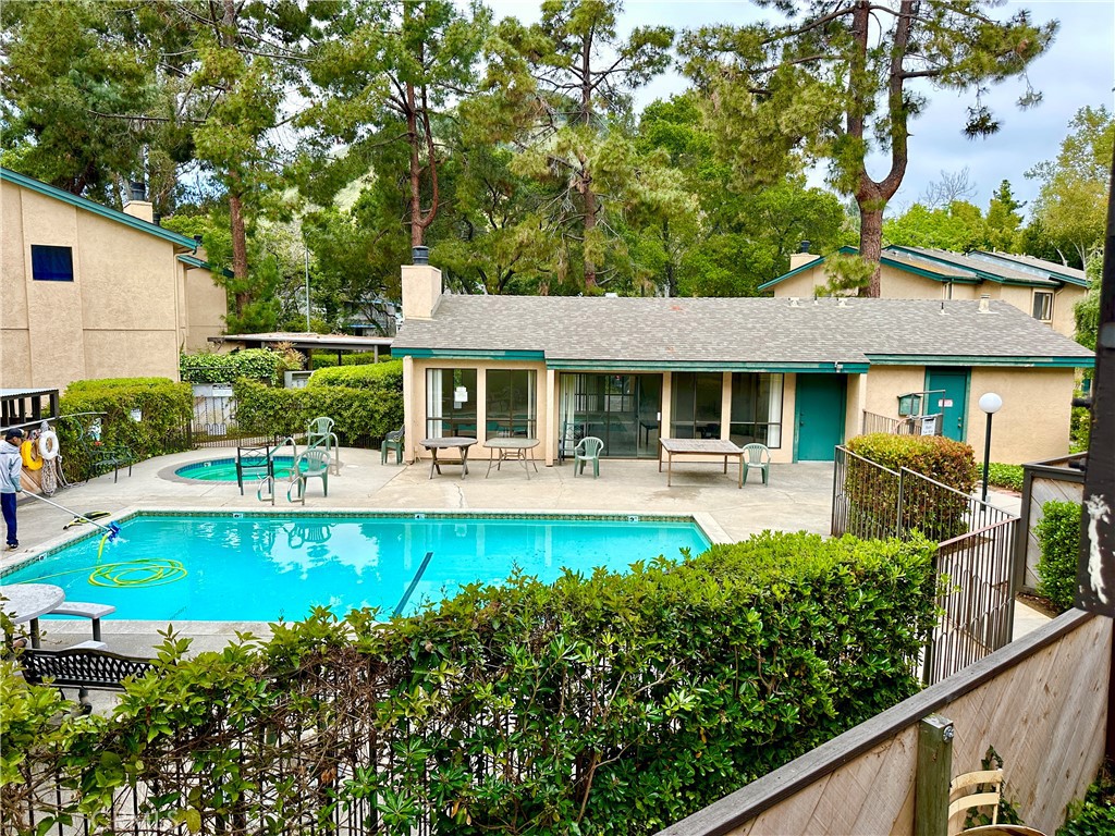 Great upstairs 2-bedroom 2-bath condo with downtown location. Located in the sought-after Mission Gardens development. Tons of natural light, vaulted ceilings, gorgeous flooring, and fireplace in living area. Sliding glass door leads to sunny deck with privacy and views of pine trees. Washer and dryer in unit. The apartment complex is full of beautifully maintained greenery. The surrounding pine trees and other flora provide a peaceful retreat steps away from all that downtown has to offer. Enjoy amenities such as a pool, spa and clubhouse.