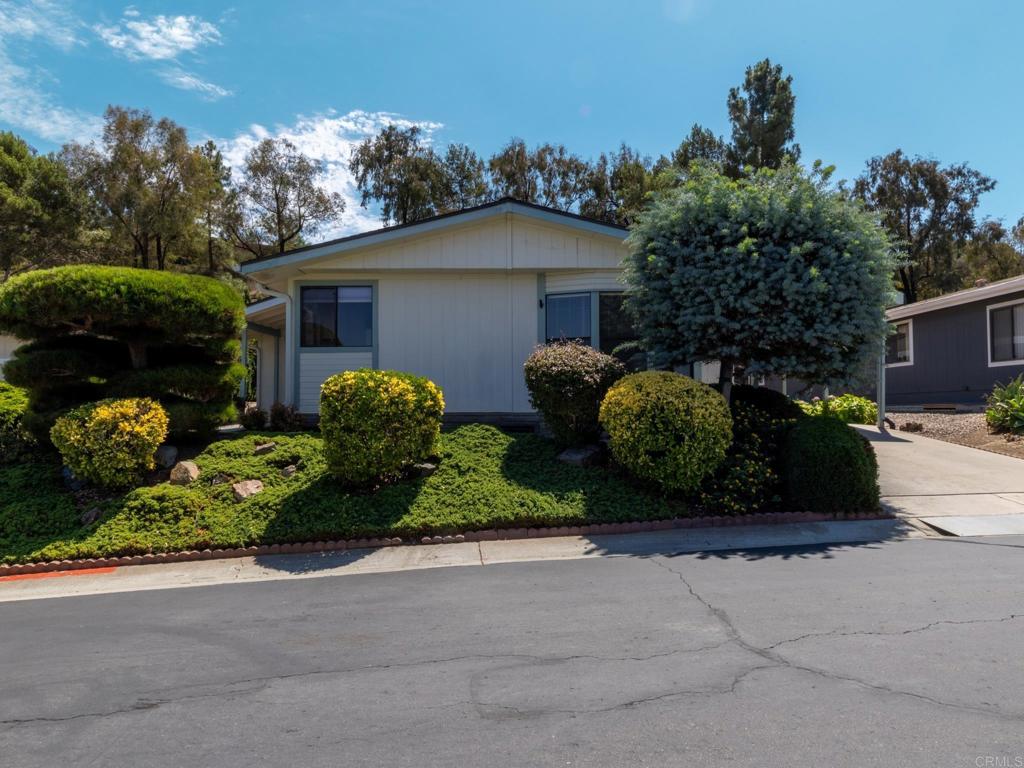 Discover 2289 Bryant Ave, Carlsbad – A Charming Retreat in a Tranquil 55+ Oasis! Step into the inviting ambiance of 2289 Bryant Ave, a well-maintained mobile/manufactured home built in 1987, nestled within a desirable gated HOA 55+ community. This thoughtfully designed property offers distinctive features that enhance its appeal, making it a wonderful choice for active adults seeking space and serenity. Spacious and Distinctive Design: This home stands out with 3 bedrooms and 2 bathrooms, providing room for family visits or a dedicated guest suite. The primary bathroom features a luxurious soaker tub, ideal for unwinding. The home also includes a garage that has extra storage space - perfect for parking or keeping belongings organized. Tranquil Backyard Retreat: Enjoy a peaceful setting with a backyard that backs directly to a lush, landscaped hill, free from neighboring views. The community is known for its calm atmosphere, and this home’s unique rear location adds an extra layer of tranquility, offering a serene escape for relaxation or quiet mornings. Prime Carlsbad Location: Situated in the heart of Carlsbad, this property is just a short drive from world-famous Legoland California. Carlsbad offers a wealth of attractions for residents, including the stunning Carlsbad State Beach for seaside strolls, the vibrant Carlsbad Village with its boutique shops and dining, and the scenic Batiquitos Lagoon Trail for nature lovers. With easy access to golf courses, the Carlsbad Premium Outlets, and top-notch healthcare facilities, this location supports an active and fulfilling lifestyle. Community Perks: Living in this gated HOA community means enjoying well-maintained grounds, a sense of security, and access to a clubhouse with a pool and tennis courts, just a short walk from your front door. These amenities enhance offer opportunities for recreation and socializing. Take your time to explore this appealing property in one of Carlsbad’s sought-after 55+ communities. Schedule a private tour today and see the unique charm of 2289 Bryant Ave for yourself!