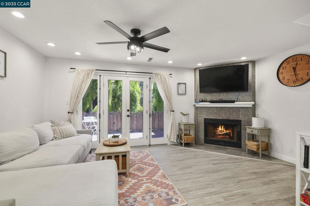 Easy living in the heart of West Danville. Come Sunday 1-4 PM to see this beautifully updated 2-story townhouse that has been thoughtfully upgraded for both style & comfort. It has an open floor plan with recessed lighting throughout, attractive marble & vinyl flooring, a modern kitchen with marble counters, as well as a gas-powered fireplace & French doors that open to an inviting enclosed private patio. The dual-pane vinyl windows with energy efficient shutters & a newer (March, 2023) furnace/air conditioning system ensure year-round comfort. Convenience is built right in, with a dedicated covered parking space located close to the home & a large private storage closet on the patio. Enjoy community amenities including a pool, spa, & clubhouse, wonderful for relaxing or entertaining. The location is ideal—just minutes from downtown Danville & top-rated schools, with quick commuter access to major routes. The HOA covers hot & cold water, garbage service, exterior and common area maintenance & professional management, allowing you to enjoy a low-maintenance lifestyle. This move-in ready home is a rare opportunity to enjoy both comfort & convenience in one of Danville’s most desirable neighborhood!