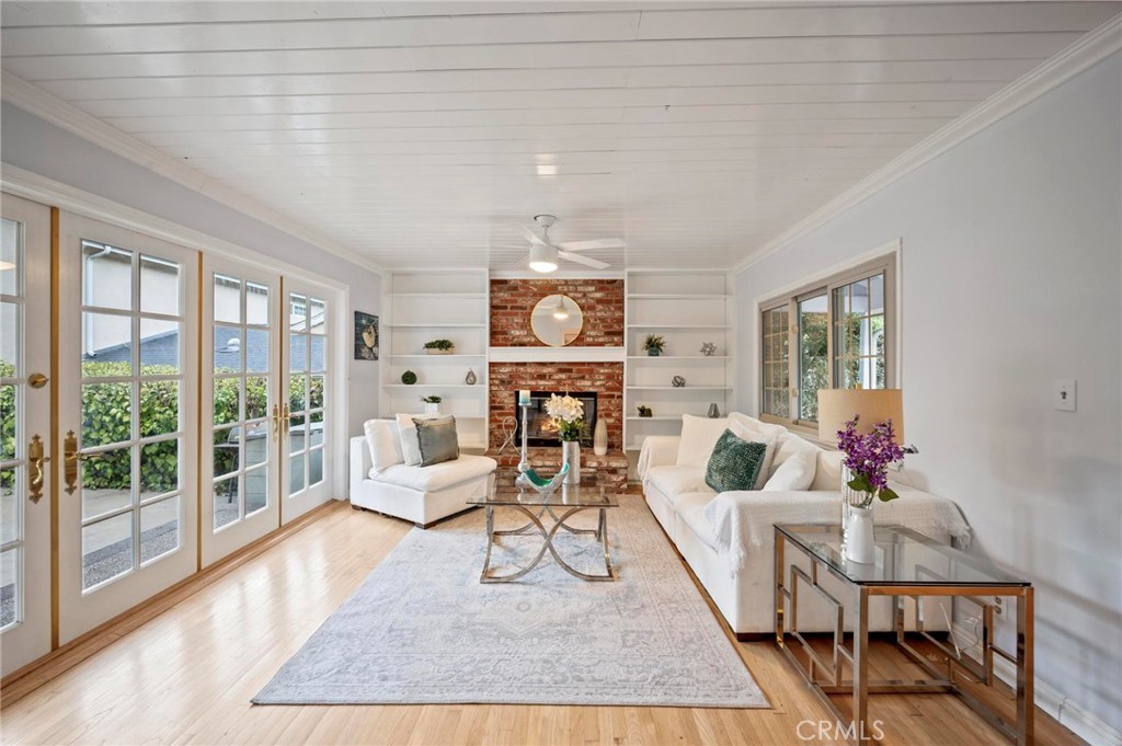 RUN! to this beautifully updated gem nestled in the heart of Woodland Hills! South of the Boulevard on a quiet street in a charming neighborhood close to everything, with efficiency galore that includes solar panels with $36/month lease payments!, a TESLA charging port, and income potential or extra living space with a gorgeous ADU. The stunning home is bathed in natural light, flows with hardwood floors, and efficiently offers pull-out kitchen shelving, large closets, and extra storage. A combination of high-end updates and classic mid-century roots enhances the home’s charm and coziness. The front brick courtyard is enchanting, and the graceful flow includes a wall of French doors in the living room that open to a spacious backyard with room for play, relaxation, and entertainment. An easy walk to parks, school, and Trader Joe’s, and wonderful neighbors all around. This is a lovely place to call home!