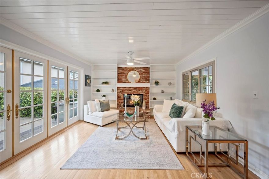 RUN! to this beautifully updated gem nestled in the heart of Woodland Hills! South of the Boulevard on a quiet street in a charming neighborhood close to everything, with efficiency galore that includes solar panels with $36/month lease payments!, a TESLA charging port, and income potential or extra living space with a gorgeous ADU.  The stunning home is bathed in natural light, flows with hardwood floors, and efficiently offers pull-out kitchen shelving, large closets, and extra storage.  A combination of high-end updates and classic mid-century roots enhances the home’s charm and coziness.  The front brick courtyard is enchanting, and the graceful flow includes a wall of French doors in the living room that open to a spacious backyard with room for play, relaxation, and entertainment.  An easy walk to parks, school, and Trader Joe’s, and wonderful neighbors all around. This is a lovely place to call home!